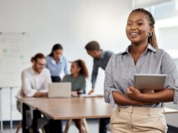 Smile, boardroom and portrait of a black woman with a tablet for training, meeting or teamwork. Happy, business and a corporate employee with technology in a work office for company planning